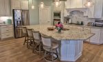 Chef-Inspired Kitchen w Stainless Steel Appliances, Granite Countertops and Island that Seats 4